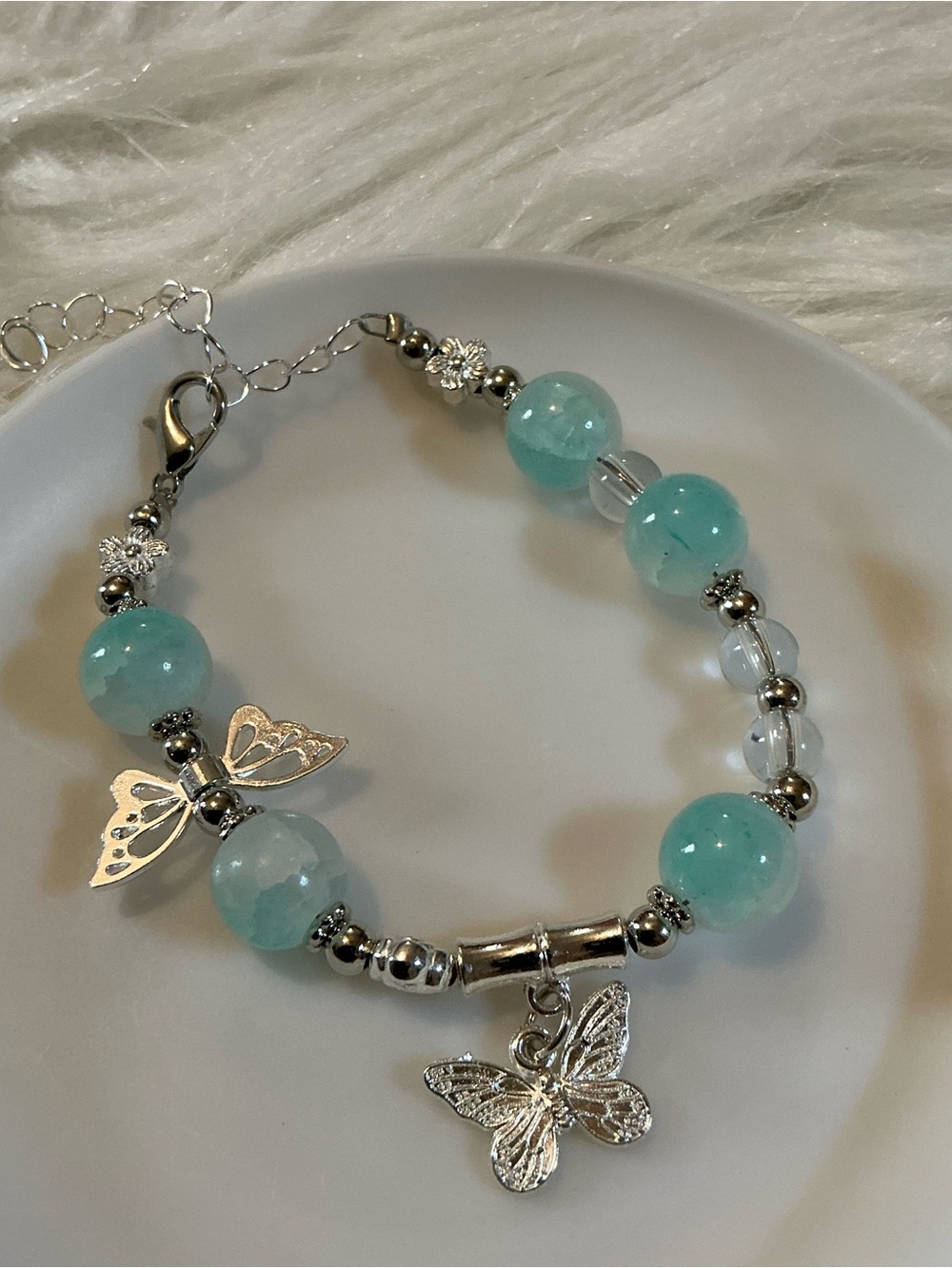 Pretty delicate butterfly silver-tone/blue bead bracelet